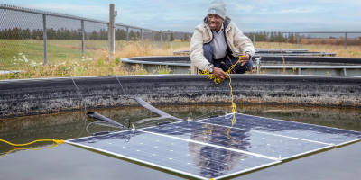 Researcher working with a solar panel.