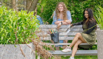 Two girls sitting on a bench