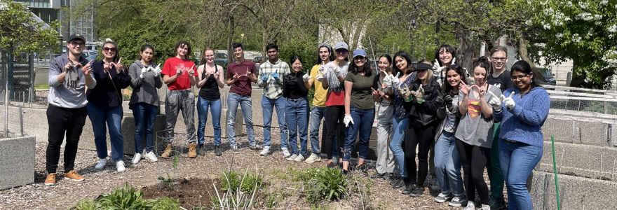 People standing outside in the Community Garden