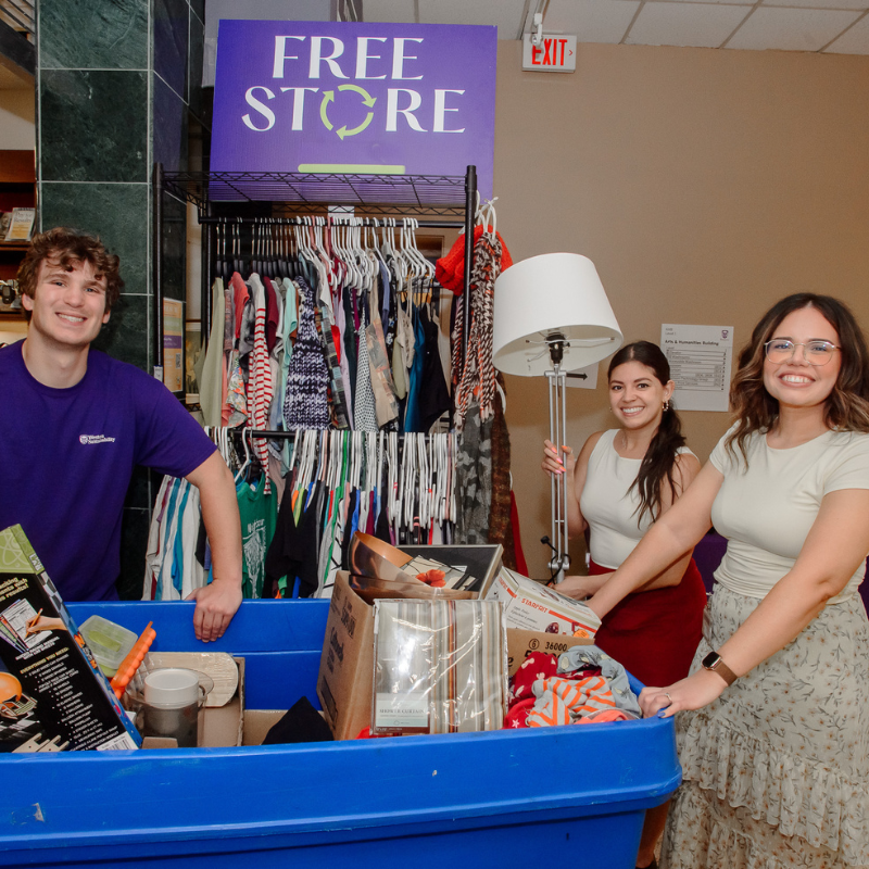 People standing outside the Free Store with donations