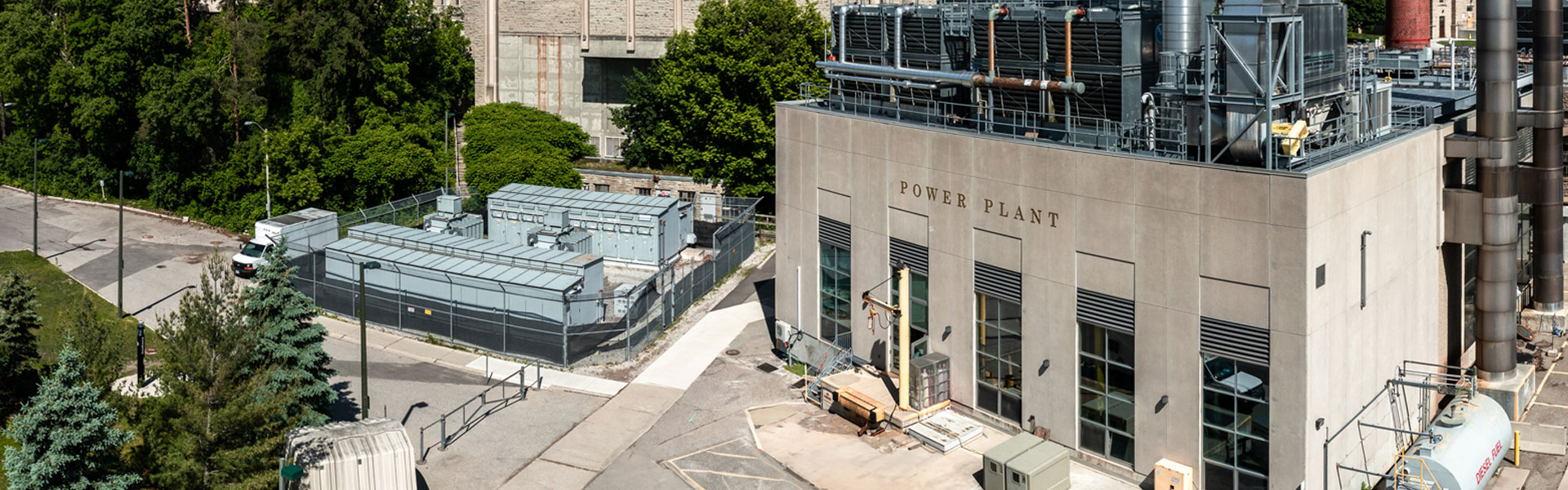 Aerial overhead look of the power plant exterior with the building's name in raised lettering across the front of the building.